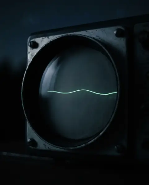 An old oscilloscope screen in a dark room, a single faint green trace wavering across the glass.